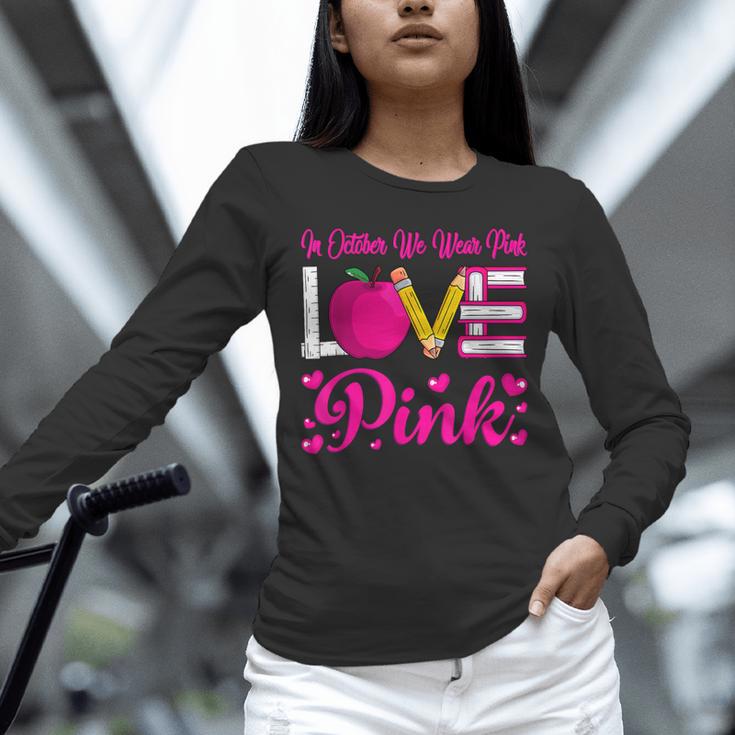 In October We Wear Pink Love Teacher Breast Cancer Awareness Unisex Long Sleeve T-Shirt, novelty gifts, funny gifts In October We Wear Pink Love Teacher Breast Cancer Awareness Unisex Long Sleeve T-Shirt, novelty gifts, funny gifts