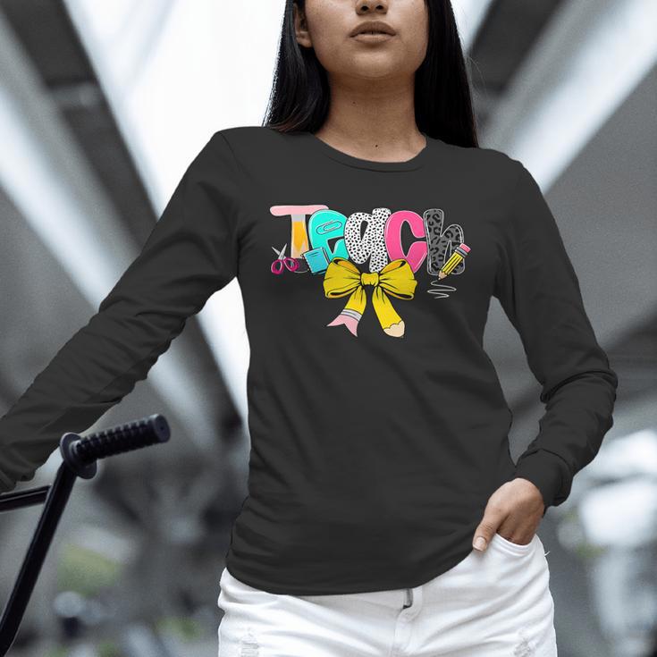 Teach Coquette Bow Teacher Back To School Happy First Day Unisex Long Sleeve T-Shirt, novelty gifts, funny gifts Teach Coquette Bow Teacher Back To School Happy First Day Unisex Long Sleeve T-Shirt, novelty gifts, funny gifts