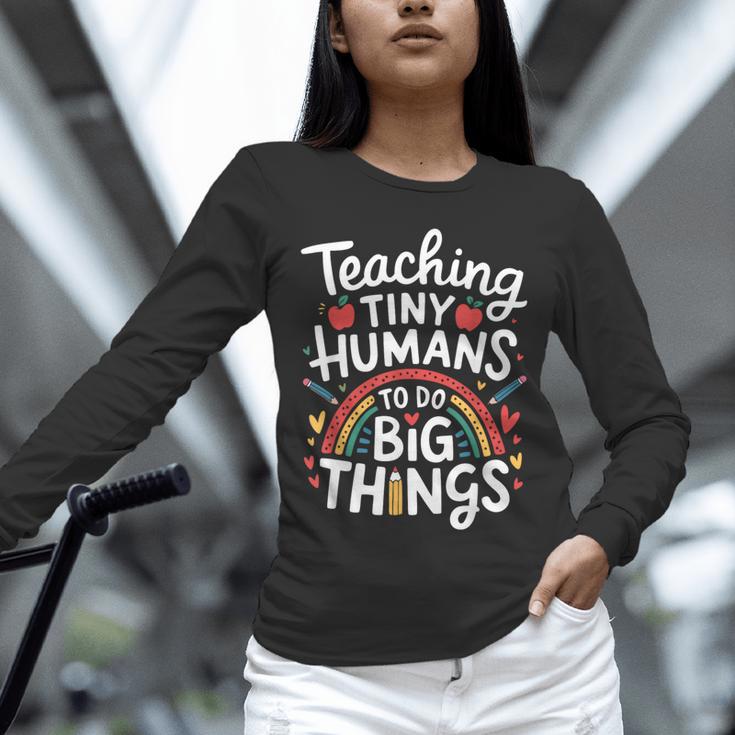 Teaching Tiny Humans Big Things I Teacher Unisex Long Sleeve T-Shirt, novelty gifts, funny gifts Teaching Tiny Humans Big Things I Teacher Unisex Long Sleeve T-Shirt, novelty gifts, funny gifts