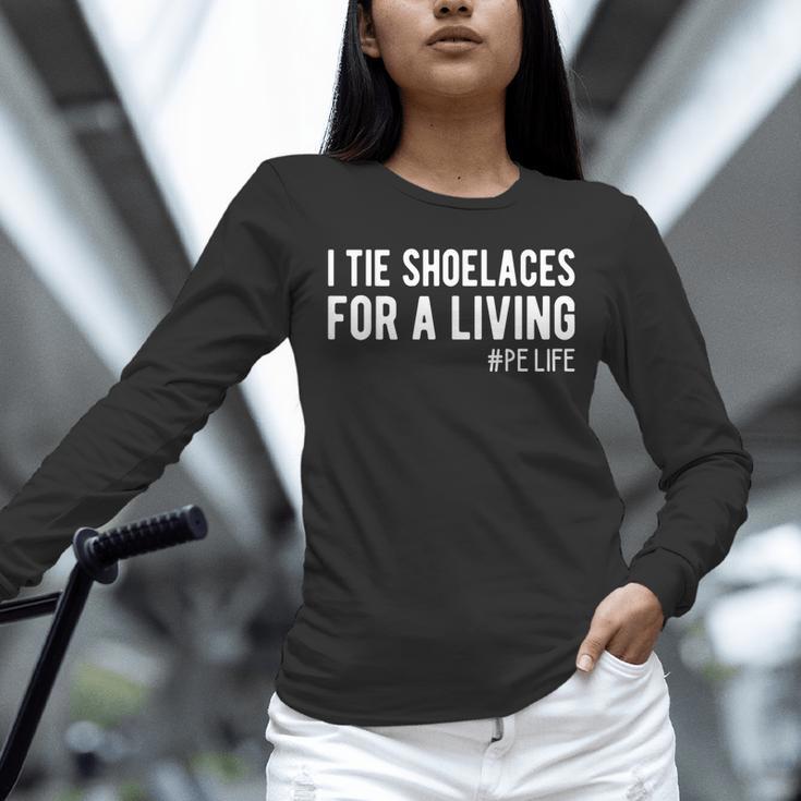 I Tie Shoelaces For a Living Elementary PE Teacher Unisex Long Sleeve T-Shirt, novelty gifts, funny gifts I Tie Shoelaces For a Living Elementary PE Teacher Unisex Long Sleeve T-Shirt, novelty gifts, funny gifts