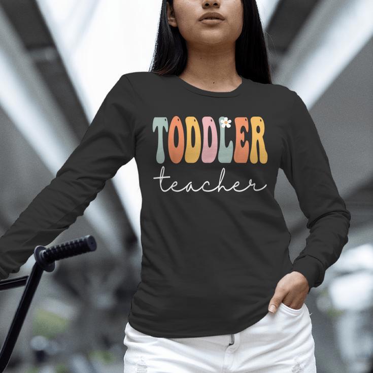 Toddler Teacher Retro Groovy Women Happy First Day Of School Unisex Long Sleeve T-Shirt, novelty gifts, funny gifts Toddler Teacher Retro Groovy Women Happy First Day Of School Unisex Long Sleeve T-Shirt, novelty gifts, funny gifts