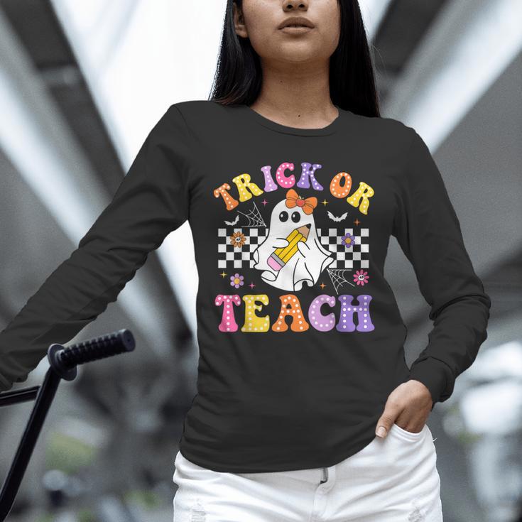 Trick Or Teach Groovy Halloween Teachers Unisex Long Sleeve T-Shirt, novelty gifts, funny gifts