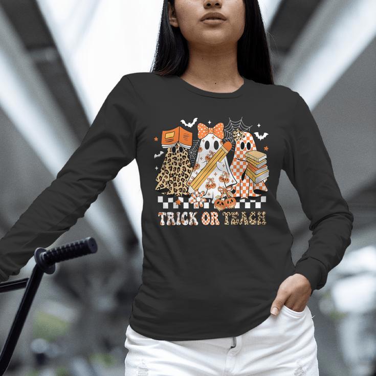 Trick Or Teach Groovy Teacher Halloween Floral Ghost Unisex Long Sleeve T-Shirt, novelty gifts, funny gifts Trick Or Teach Groovy Teacher Halloween Floral Ghost Unisex Long Sleeve T-Shirt, novelty gifts, funny gifts