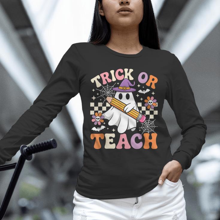 Trick Or Teach Groovy Teacher Halloween Retro Ghost Unisex Long Sleeve T-Shirt, novelty gifts, funny gifts