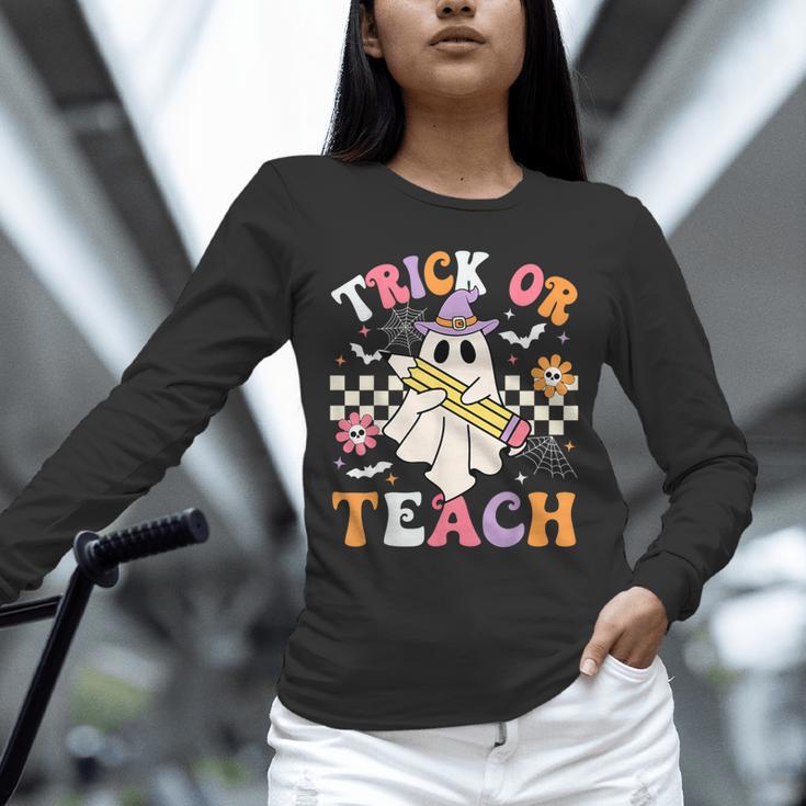 Trick Or Teach Groovy Teacher Halloween Retro Teacher Ghost Unisex Long Sleeve T-Shirt, novelty gifts, funny gifts Trick Or Teach Groovy Teacher Halloween Retro Teacher Ghost Unisex Long Sleeve T-Shirt, novelty gifts, funny gifts