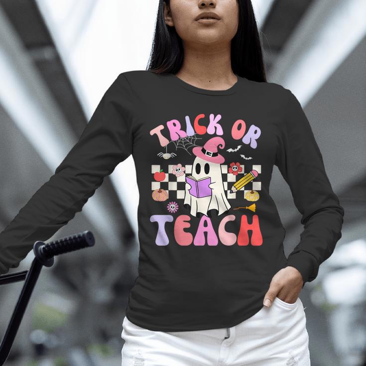 Trick Or Teach Halloween Teacher Floral Ghost Groovy Unisex Long Sleeve T-Shirt, novelty gifts, funny gifts Trick Or Teach Halloween Teacher Floral Ghost Groovy Unisex Long Sleeve T-Shirt, novelty gifts, funny gifts