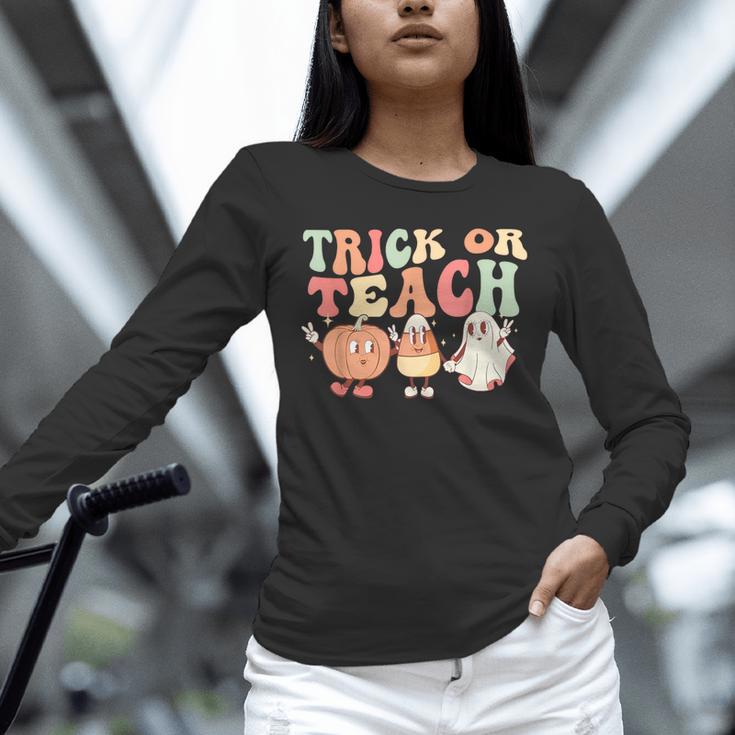 Trick Or Teach Pumpkin Candy Corn Ghost Halloween Teacher Unisex Long Sleeve T-Shirt, novelty gifts, funny gifts Trick Or Teach Pumpkin Candy Corn Ghost Halloween Teacher Unisex Long Sleeve T-Shirt, novelty gifts, funny gifts