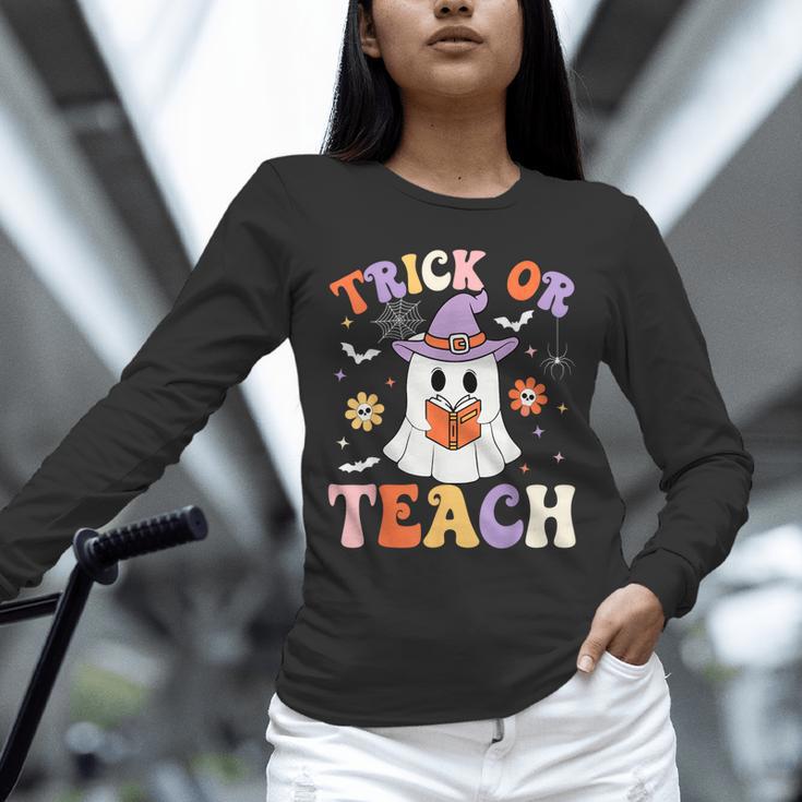 Trick Or Teach Teacher Groovy Ghost Halloween Teacher Unisex Long Sleeve T-Shirt, novelty gifts, funny gifts