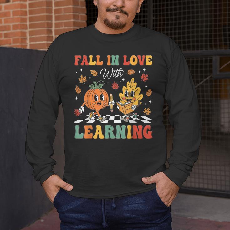 Groovy Fall In Love With Learning Autumn Pumpkin Teacher Men's Long Sleeve T-Shirt, funny design