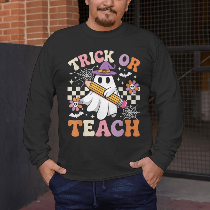 Trick Or Teach Groovy Teacher Halloween Retro Ghost Men's Long Sleeve T-Shirt, funny design Trick Or Teach Groovy Teacher Halloween Retro Ghost Men's Long Sleeve T-Shirt, funny design