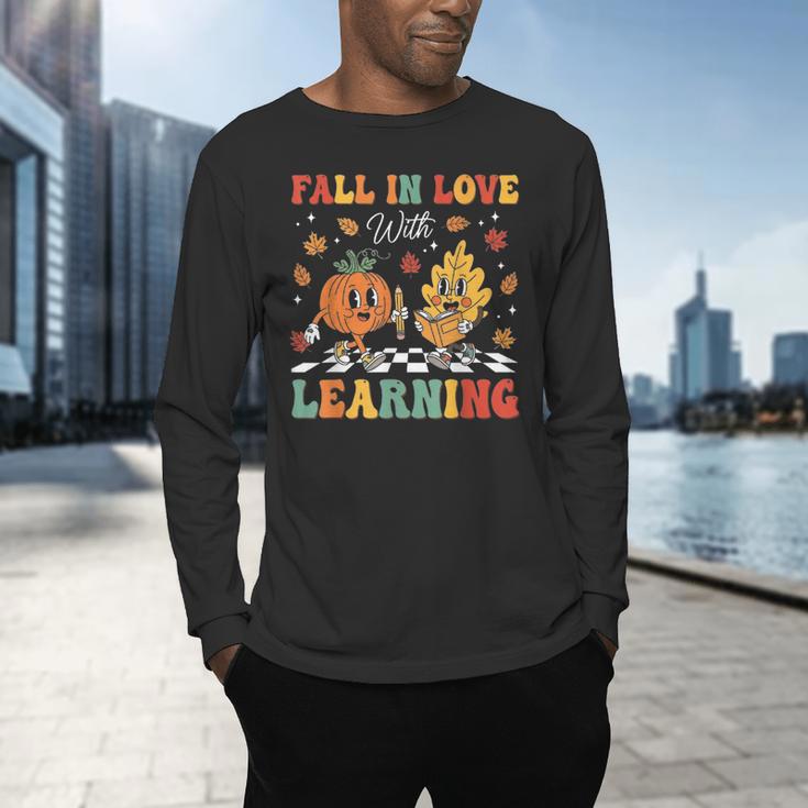 Groovy Fall In Love With Learning Autumn Pumpkin Teacher Men's Long Sleeve T-Shirt, gift for family, gift for coworker