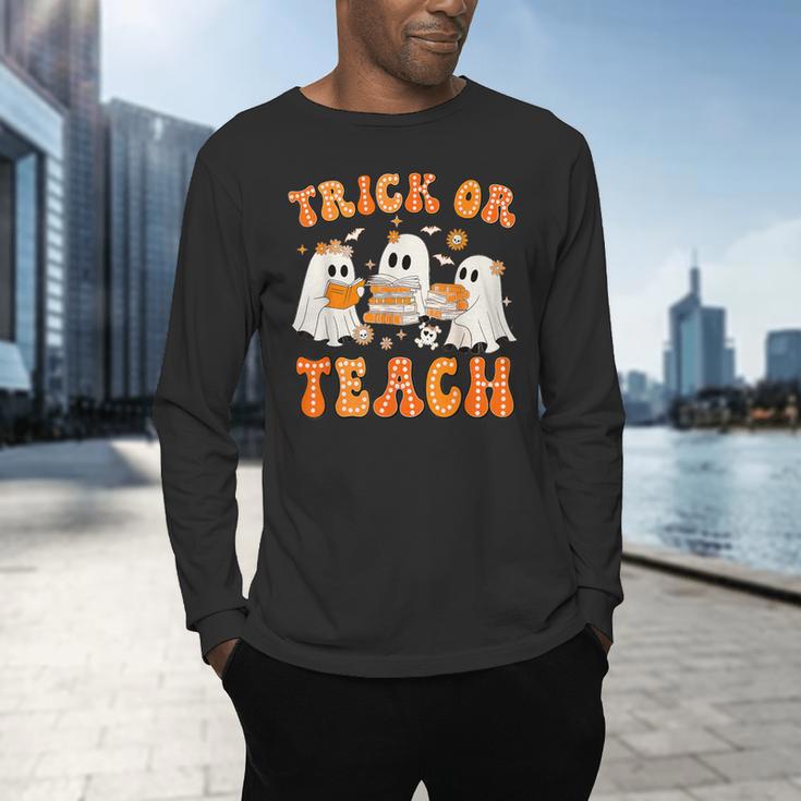 Teacher Halloween Trick Or Teach Retro Groovy Floral Ghost Men's Long Sleeve T-Shirt, gift for family, gift for coworker Teacher Halloween Trick Or Teach Retro Groovy Floral Ghost Men's Long Sleeve T-Shirt, gift for family, gift for coworker