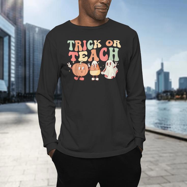 Trick Or Teach Pumpkin Candy Corn Ghost Halloween Teacher Men's Long Sleeve T-Shirt, gift for family, gift for coworker Trick Or Teach Pumpkin Candy Corn Ghost Halloween Teacher Men's Long Sleeve T-Shirt, gift for family, gift for coworker