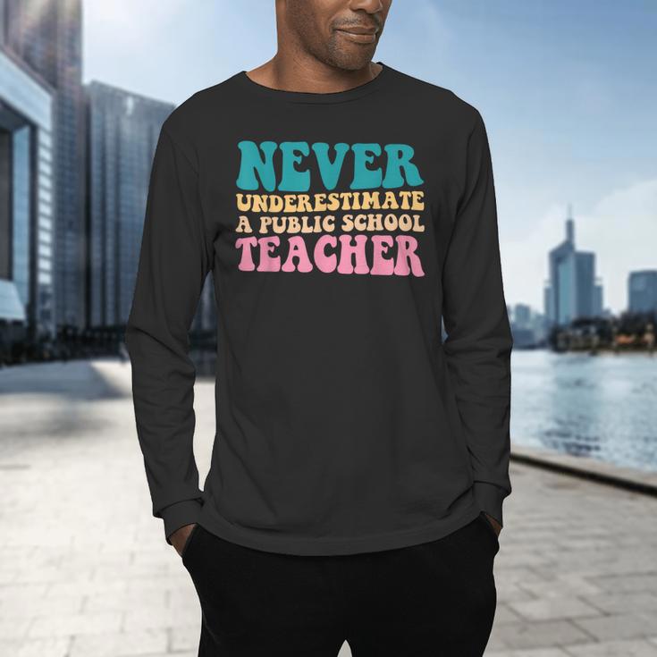 Never Underestimate A Public School Teacher Groovy Women Men's Long Sleeve T-Shirt, gift for family, gift for coworker Never Underestimate A Public School Teacher Groovy Women Men's Long Sleeve T-Shirt, gift for family, gift for coworker