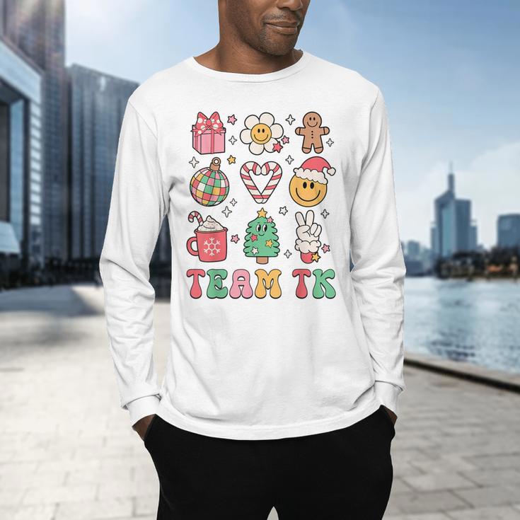 Team TK Teacher Christmas Groovy Smile Face Girl Boy Kid TK Men's Long Sleeve T-Shirt, gift for family, gift for coworker