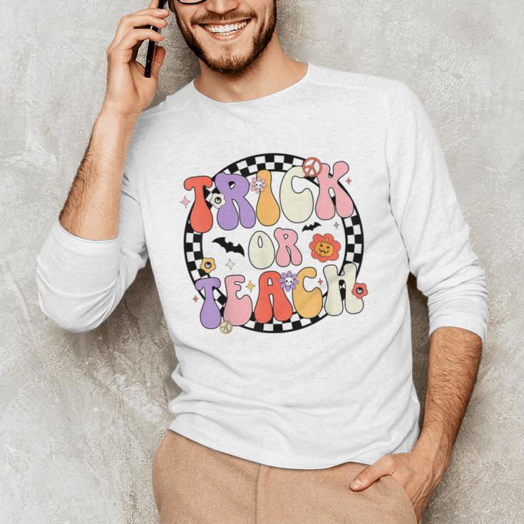 Trick Or Teach Retro Groovy Halloween Teacher Men's Long Sleeve T-Shirt, novelty gifts, funny gifts Trick Or Teach Retro Groovy Halloween Teacher Men's Long Sleeve T-Shirt, novelty gifts, funny gifts