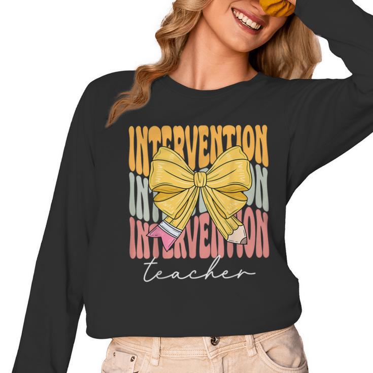 Interventionist Teacher Groovy Coquette Bow Back To School Women Long Sleeve T-Shirt, Groovy Teacher Gifts, trending gift Interventionist Teacher Groovy Coquette Bow Back To School Women Long Sleeve T-Shirt, Groovy Teacher Gifts, trending gift