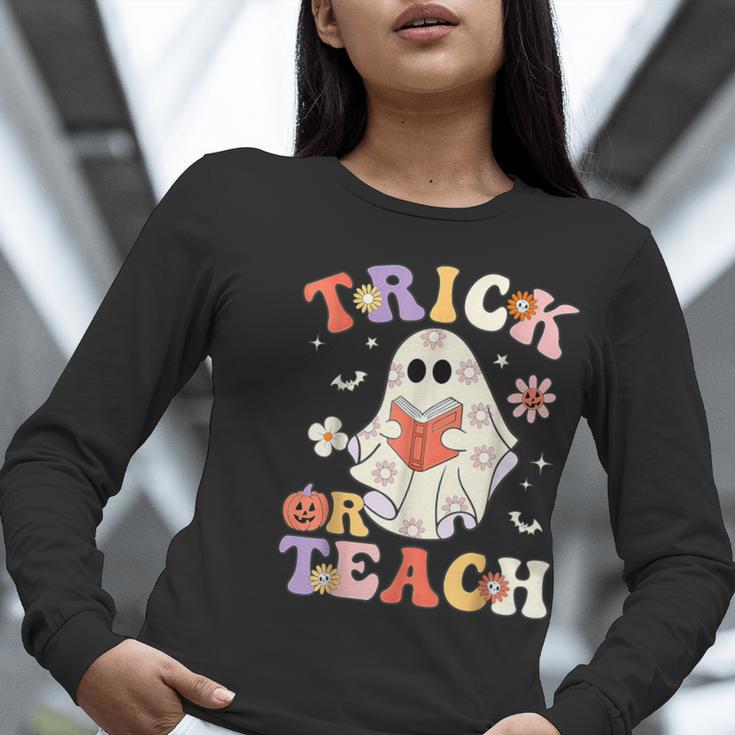 Groovy Halloween Trick Or Teach Retro Floral Ghost Teacher Women Long Sleeve T-Shirt, Groovy Teacher Shirts, funny gift Groovy Halloween Trick Or Teach Retro Floral Ghost Teacher Women Long Sleeve T-Shirt, Groovy Teacher Shirts, funny gift