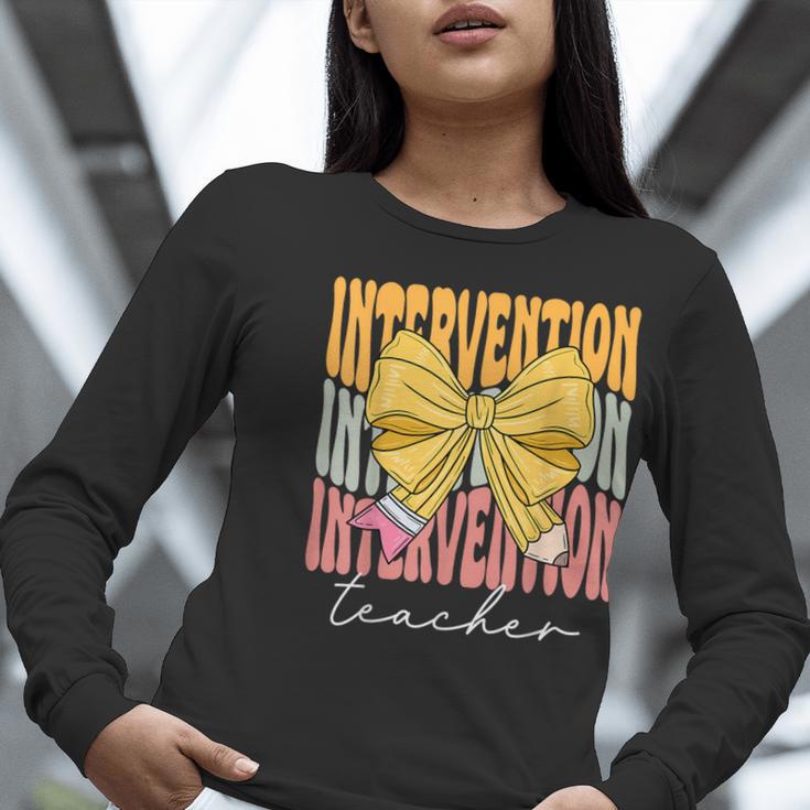 Interventionist Teacher Groovy Coquette Bow Back To School Women Long Sleeve T-Shirt, Groovy Teacher Shirts, funny gift Interventionist Teacher Groovy Coquette Bow Back To School Women Long Sleeve T-Shirt, Groovy Teacher Shirts, funny gift