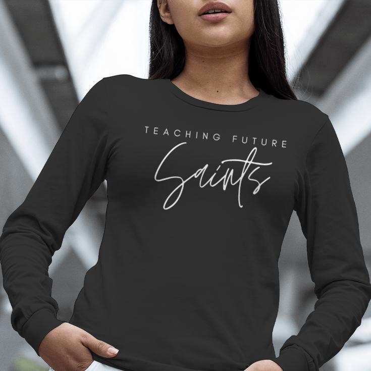 Teaching Future Saints Catholic Teacher Women Long Sleeve T-Shirt, Future Teacher Shirts, funny gift Teaching Future Saints Catholic Teacher Women Long Sleeve T-Shirt, Future Teacher Shirts, funny gift