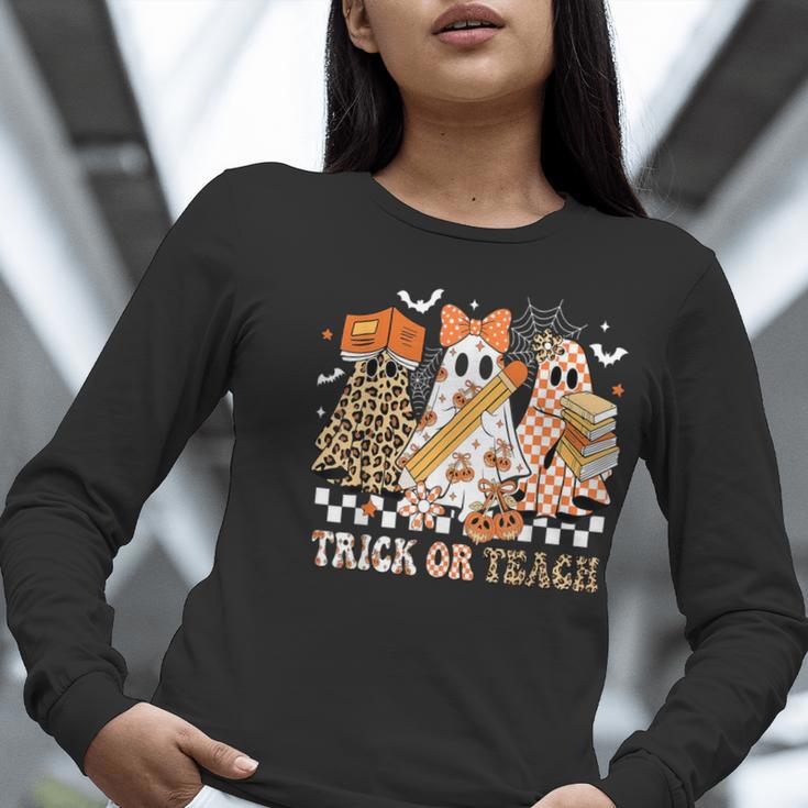Trick Or Teach Groovy Teacher Halloween Floral Ghost Women Long Sleeve T-Shirt, Groovy Teacher Shirts, funny gift