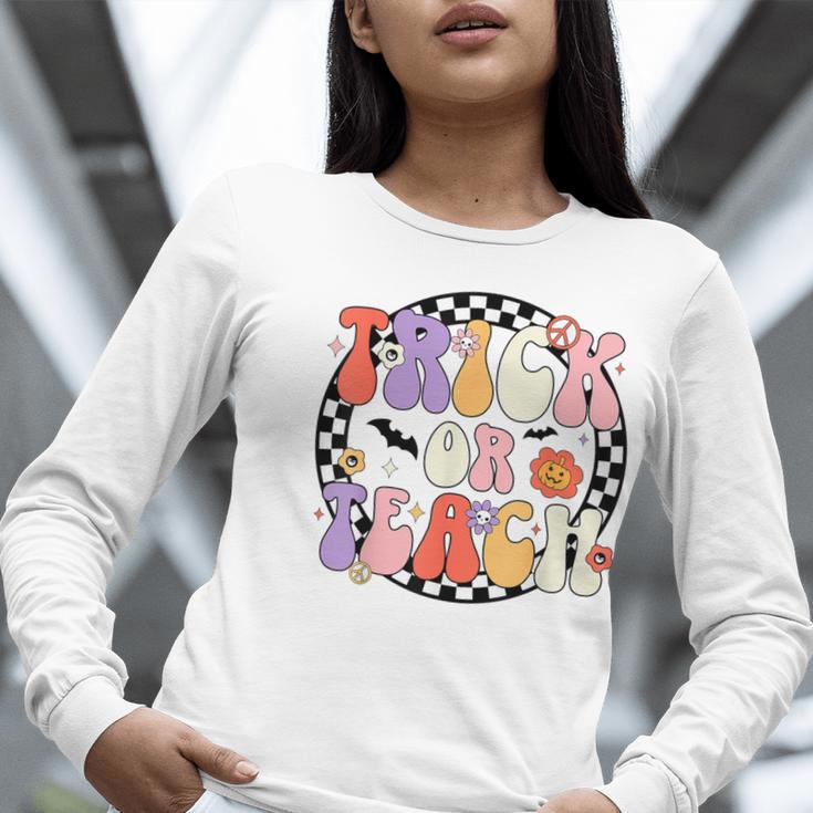 Trick Or Teach Retro Groovy Halloween Teacher Women Long Sleeve T-Shirt, Groovy Teacher Shirts, funny gift