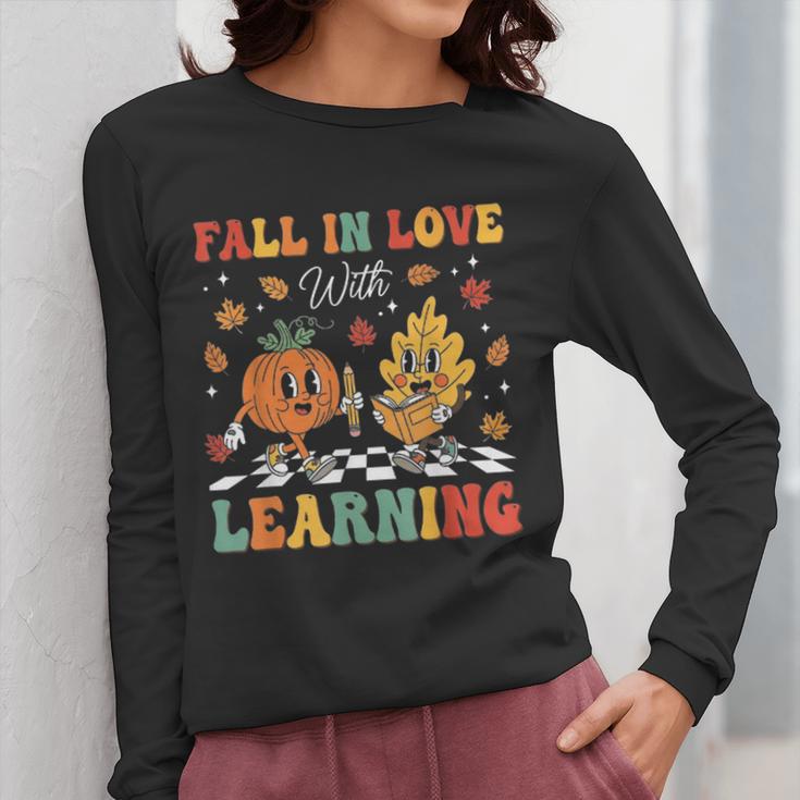 Groovy Fall In Love With Learning Autumn Pumpkin Teacher Women Long Sleeve T-Shirt, Groovy Teacher Gifts, funny design
