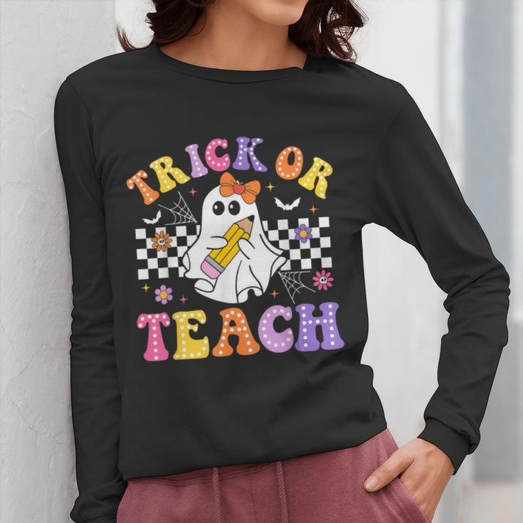 Trick Or Teach Groovy Halloween Teachers Women Long Sleeve T-Shirt, funny design