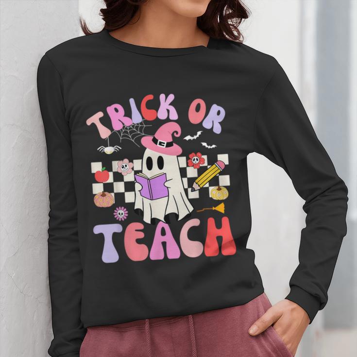 Trick Or Teach Halloween Teacher Floral Ghost Groovy Women Long Sleeve T-Shirt, Groovy Teacher Gifts, funny design Trick Or Teach Halloween Teacher Floral Ghost Groovy Women Long Sleeve T-Shirt, Groovy Teacher Gifts, funny design