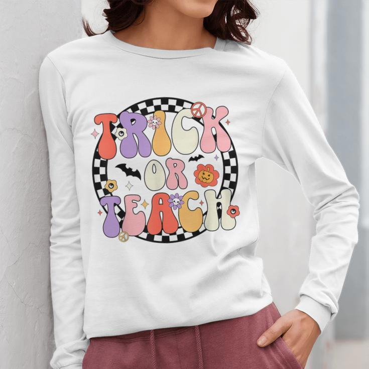 Trick Or Teach Retro Groovy Halloween Teacher Women Long Sleeve T-Shirt, Groovy Teacher Gifts, funny design