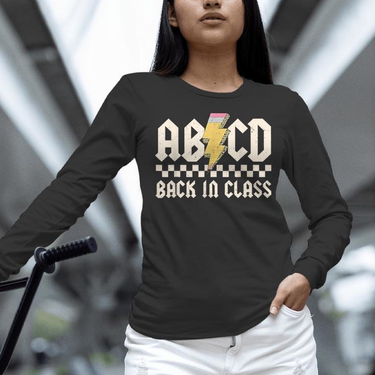 Boys Girls Teachers Rock Back To School ABCD Back In Class Women Long Sleeve T-Shirt, gift for family, gift for coworker