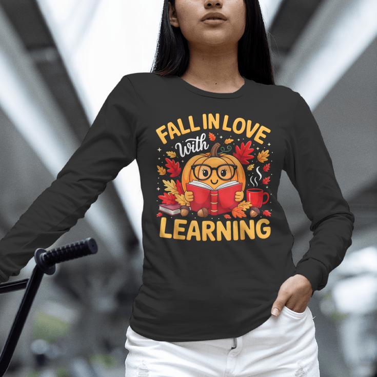 Fall In Love With Learning Pumpkin Thanksgiving Teacher Fall Women Long Sleeve T-Shirt, gift for family, gift for coworker