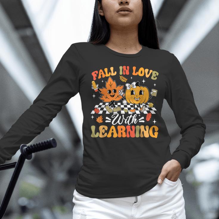 Fall In Love With Learning Fall Teacher Thanksgiving Retro Women Long Sleeve T-Shirt, gift for family, gift for coworker