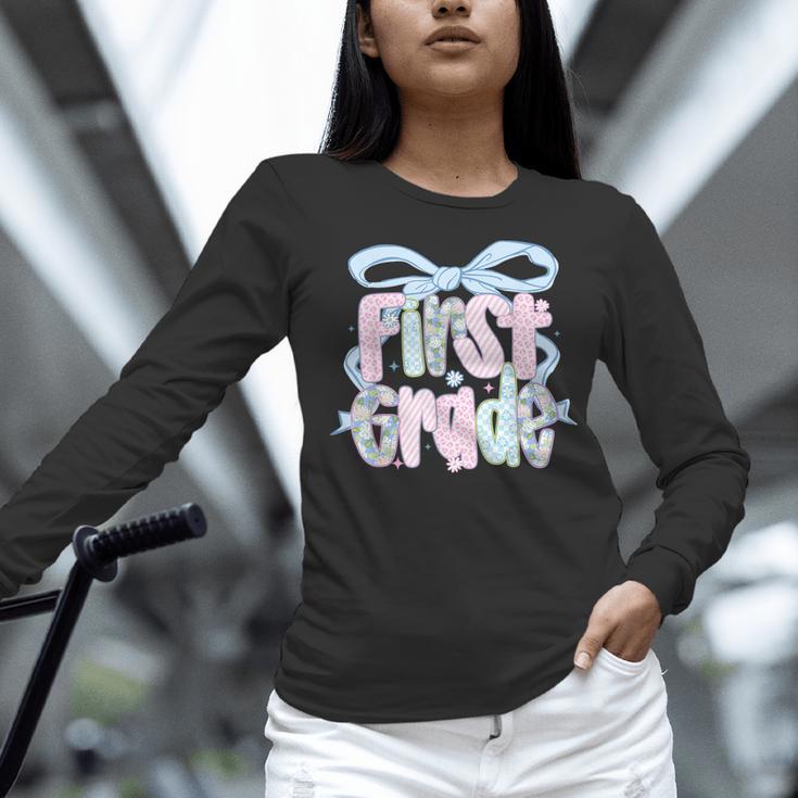 First Grade Coquette Bow Girls Teacher Team 1st Grade Squad Women Long Sleeve T-Shirt, First Grade Teacher Shirts, gift for family, gift for coworker