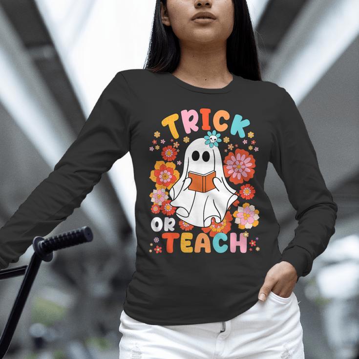 Groovy Halloween Trick Or Teach Retro Floral Ghost Teacher For Men Women Kids Women Long Sleeve T-Shirt, Groovy Teacher Shirts, gift for family, gift for coworker Groovy Halloween Trick Or Teach Retro Floral Ghost Teacher For Men Women Kids Women Long Sleeve T-Shirt, Groovy Teacher Shirts, gift for family, gift for coworker