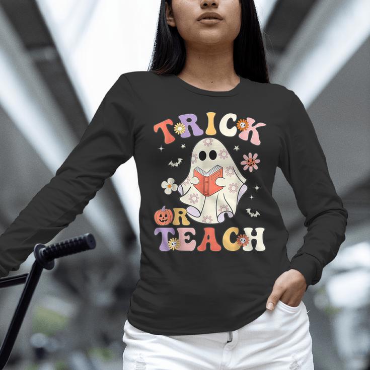 Groovy Halloween Trick Or Teach Retro Floral Ghost Teacher Women Long Sleeve T-Shirt, Groovy Teacher Shirts, gift for family, gift for coworker Groovy Halloween Trick Or Teach Retro Floral Ghost Teacher Women Long Sleeve T-Shirt, Groovy Teacher Shirts, gift for family, gift for coworker
