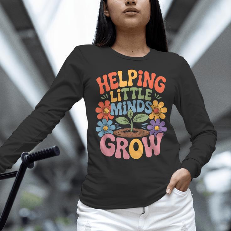 Helping Little Minds Grow Teacher First Day Back To School Women Long Sleeve T-Shirt, gift for family, gift for coworker Helping Little Minds Grow Teacher First Day Back To School Women Long Sleeve T-Shirt, gift for family, gift for coworker
