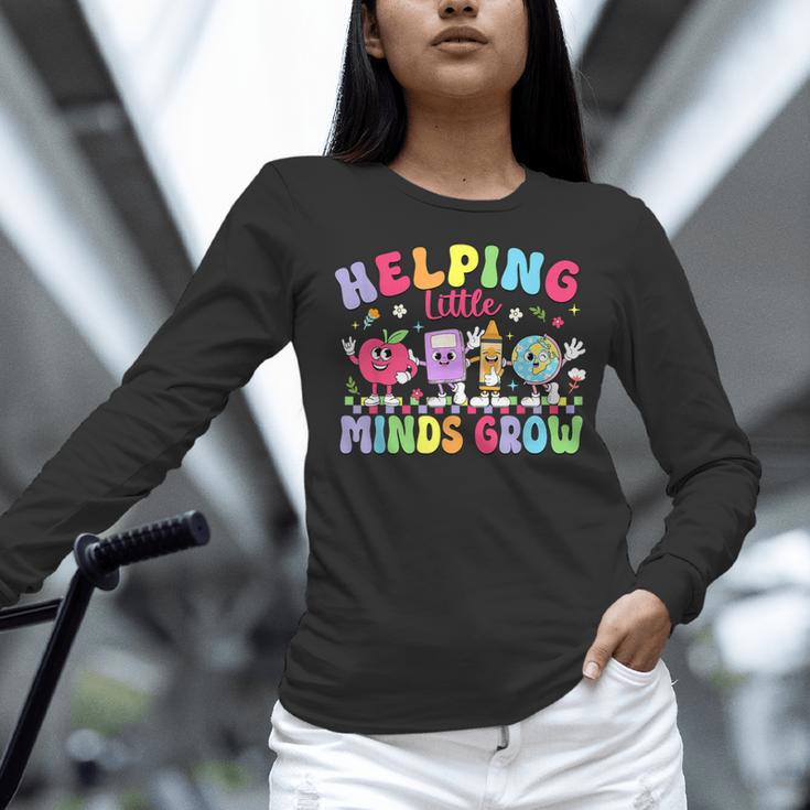 Helping Little Minds Grow Teacher Life Back To School Women Long Sleeve T-Shirt, gift for family, gift for coworker Helping Little Minds Grow Teacher Life Back To School Women Long Sleeve T-Shirt, gift for family, gift for coworker