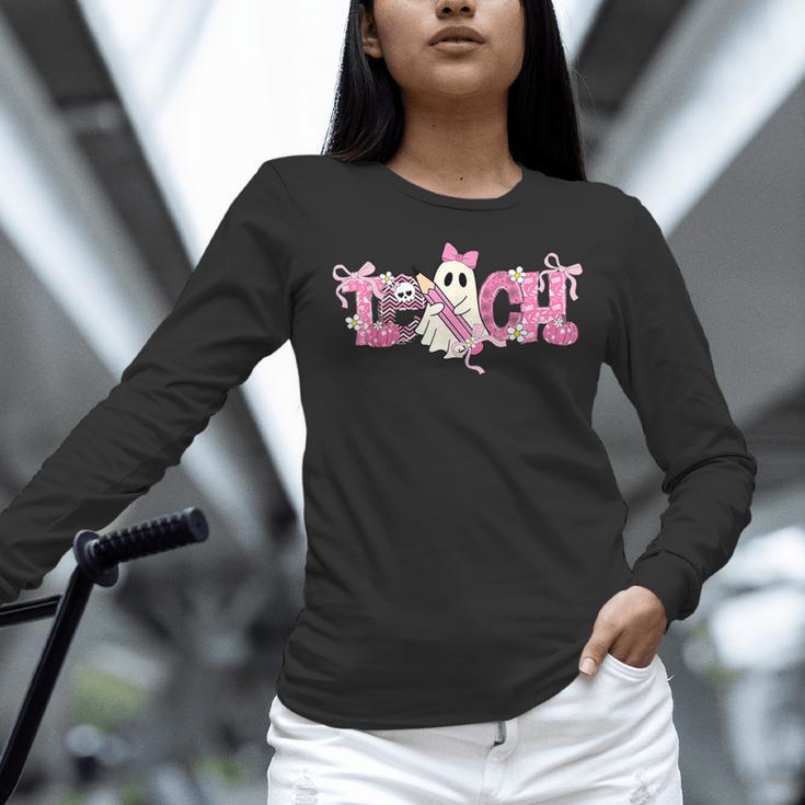 Pink Ghost Teach Halloween Teacher In Spooky Season Women Long Sleeve T-Shirt, gift for family, gift for coworker Pink Ghost Teach Halloween Teacher In Spooky Season Women Long Sleeve T-Shirt, gift for family, gift for coworker