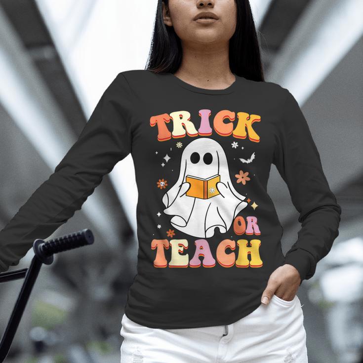 Retro Vintage Groovy Trick Or Teach Teacher Halloween For Men Women Kids Women Long Sleeve T-Shirt, Groovy Teacher Shirts, gift for family, gift for coworker