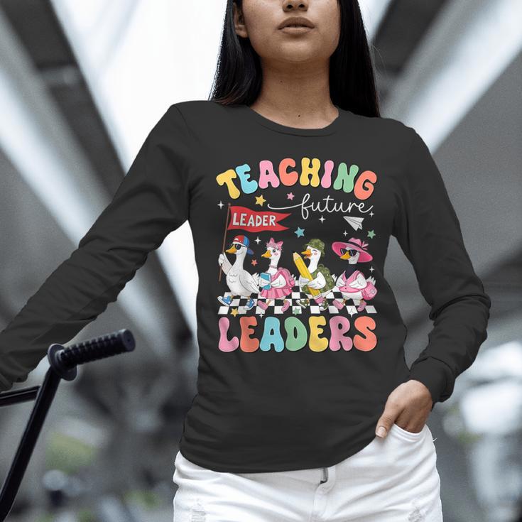 Teaching Future Leaders Groovy Teacher Back To School Women Long Sleeve T-Shirt, Future Teacher Shirts, Groovy Teacher Shirts, gift for family, gift for coworker