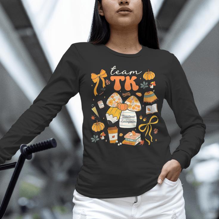 Team TK Crew Preppy Coquette Bow Pumpkin Fall TK Teacher Women Long Sleeve T-Shirt, gift for family, gift for coworker