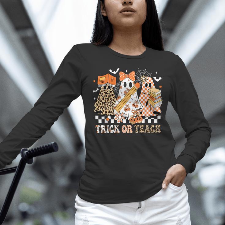 Trick Or Teach Groovy Teacher Halloween Floral Ghost Women Long Sleeve T-Shirt, Groovy Teacher Shirts, gift for family, gift for coworker
