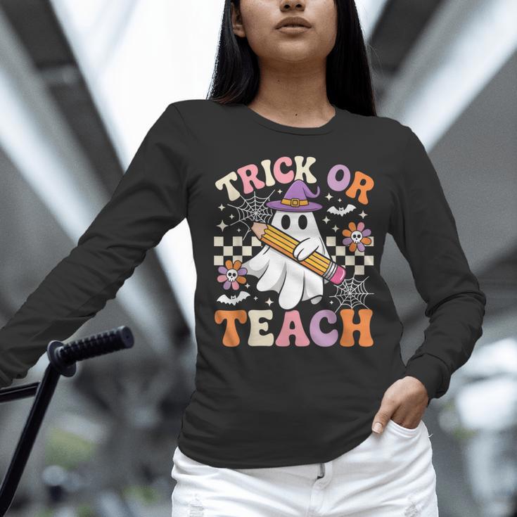 Trick Or Teach Groovy Teacher Halloween Retro Ghost Women Long Sleeve T-Shirt, Groovy Teacher Shirts, gift for family, gift for coworker