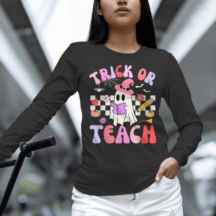 Trick Or Teach Halloween Teacher Floral Ghost Groovy Women Long Sleeve T-Shirt, Groovy Teacher Shirts, gift for family, gift for coworker Trick Or Teach Halloween Teacher Floral Ghost Groovy Women Long Sleeve T-Shirt, Groovy Teacher Shirts, gift for family, gift for coworker
