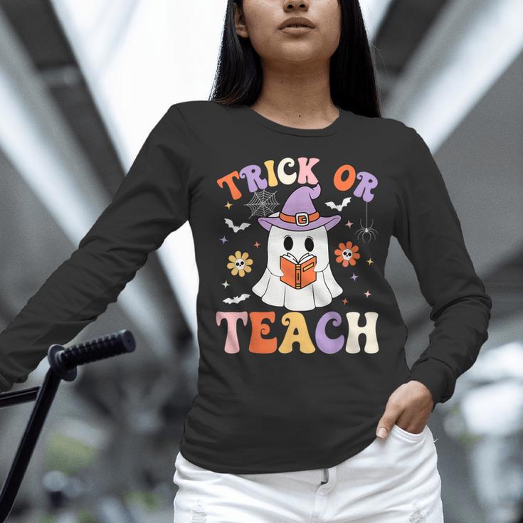 Trick Or Teach Teacher Groovy Ghost Halloween Teacher Women Long Sleeve T-Shirt, Groovy Teacher Shirts, gift for family, gift for coworker