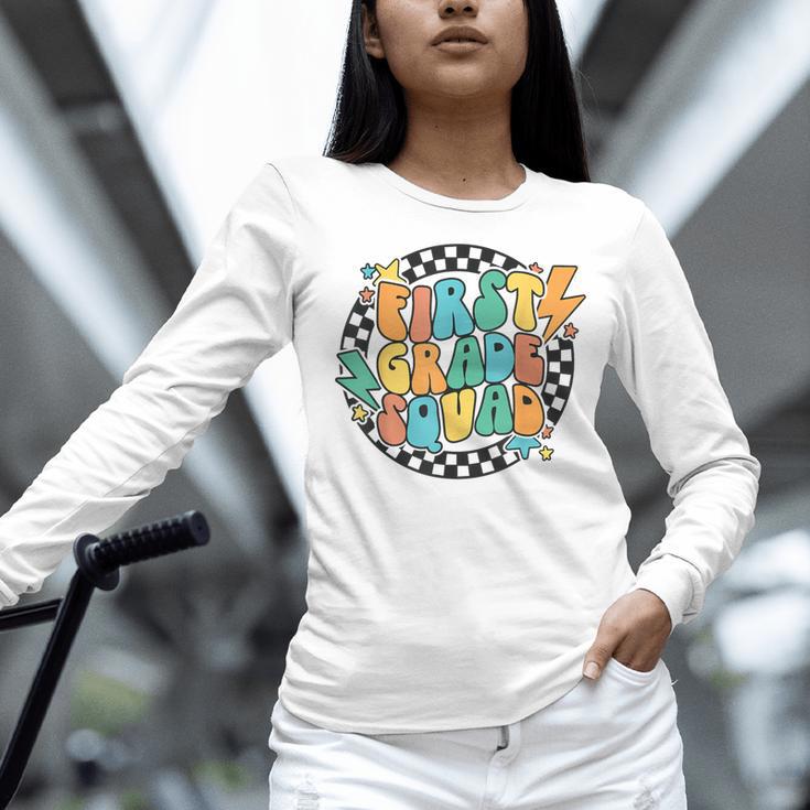 Back To School Groovy Teacher 1st First Grade Crew Squad Women Long Sleeve T-Shirt, Groovy Teacher Shirts, First Grade Teacher Shirts, gift for family, gift for coworker