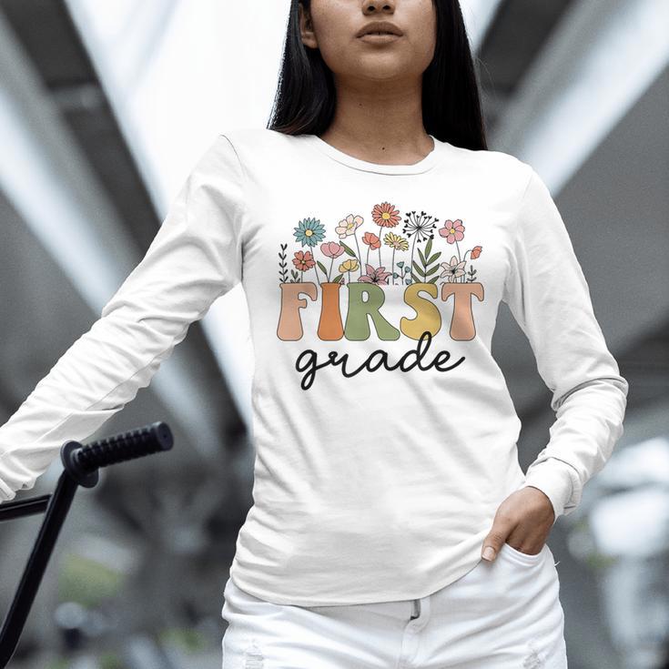 First Grade Teacher Wildflower Back To School Floral Outfits Women Long Sleeve T-Shirt, First Grade Teacher Shirts, gift for family, gift for coworker