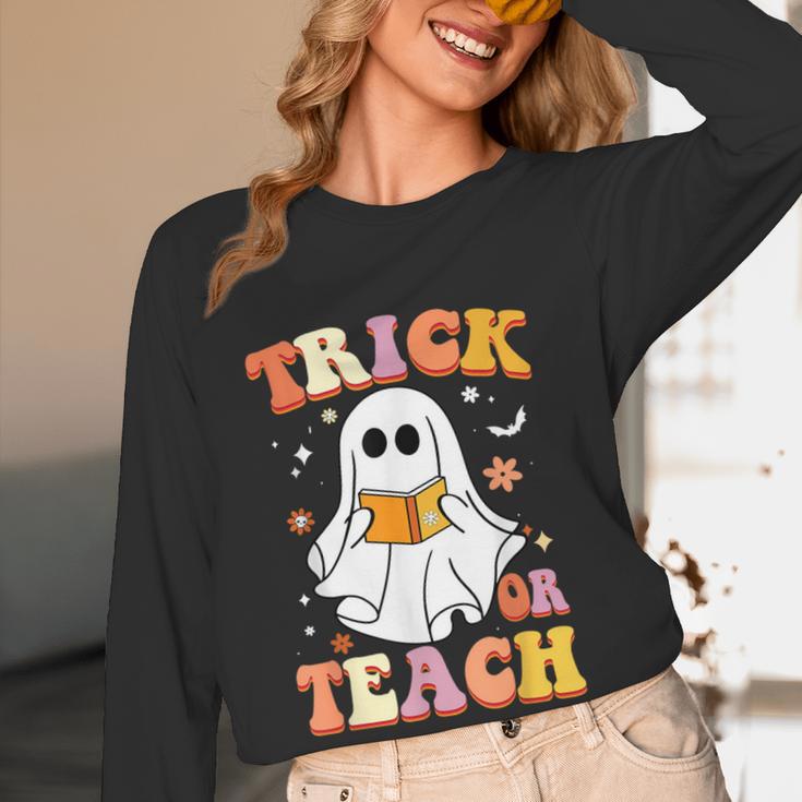 Retro Vintage Groovy Trick Or Teach Teacher Halloween For Men Women Kids Women Long Sleeve T-Shirt, novelty gifts, funny gifts