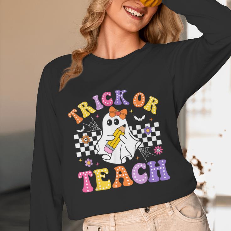 Trick Or Teach Groovy Halloween Teachers Women Long Sleeve T-Shirt, novelty gifts, funny gifts